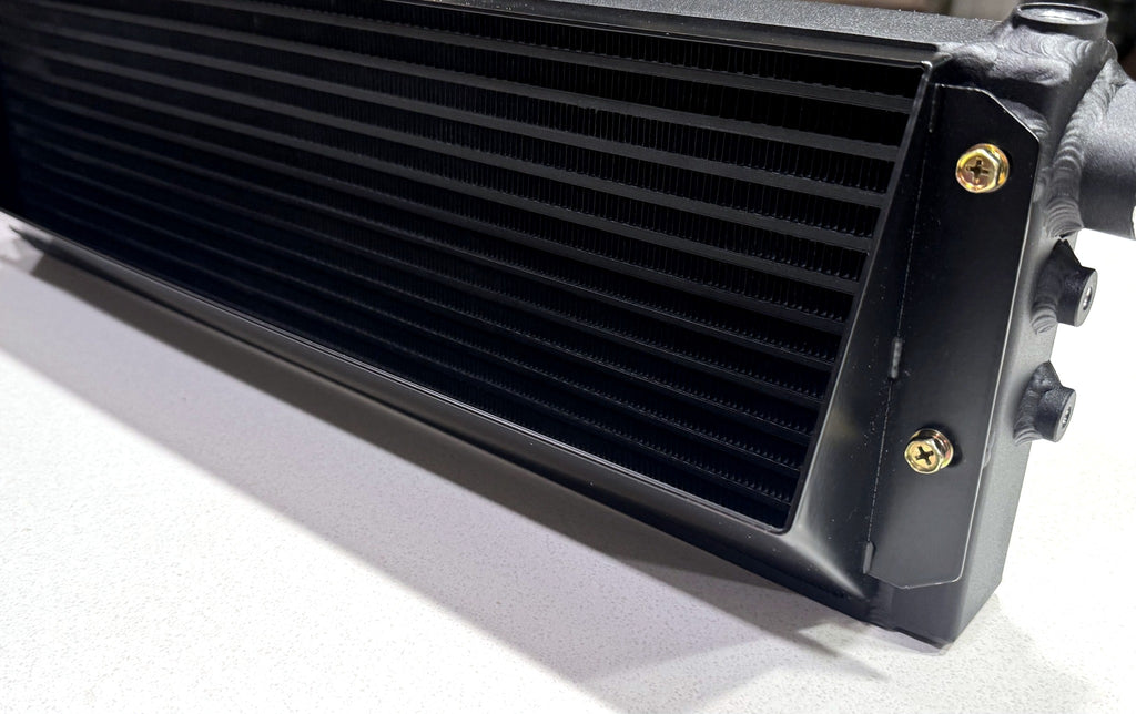 Close up of Dyne Performance USA W204 C63 oil cooler end tank and fittings