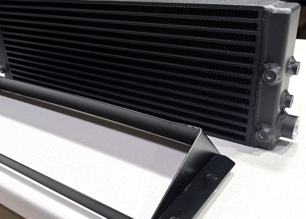 Dyne Performance USA W204 C63 oil cooler with shroud, angled view showing core depth and ports
